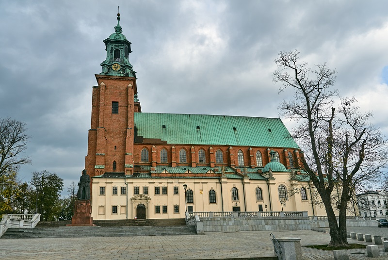 Gothic cathedral church with towers in autumn in Gniezno